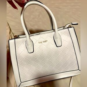 NEW nine west purse still has plastic covers on it